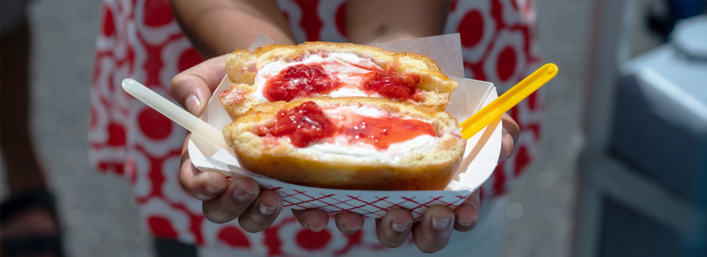 Overhead close-up shot of someone holding a Doughboy special: Donut Panini.